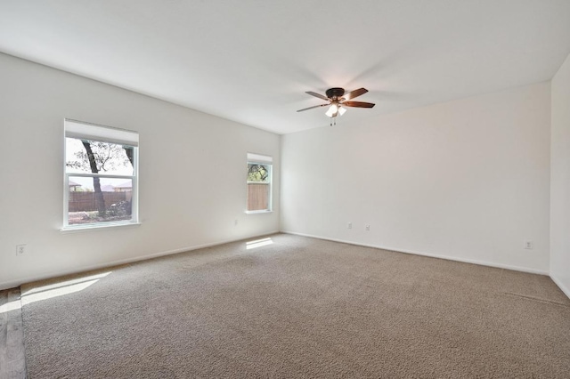 234 Coleto Creek Loop, Kyle, TX 78640 - empty room featuring ceiling fan, carpet floors, and baseboards