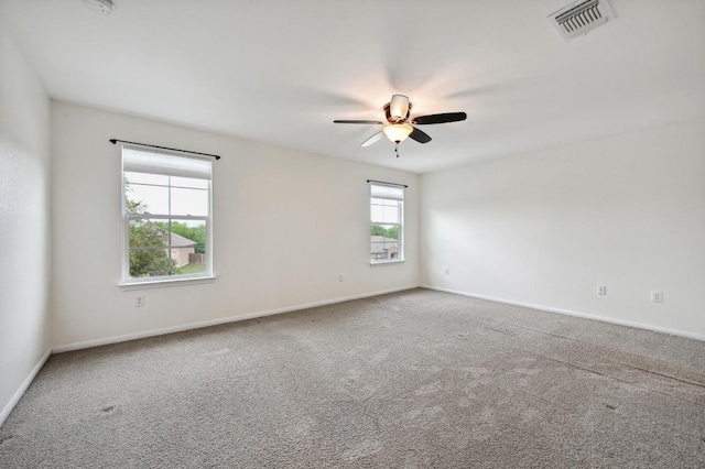 234 Coleto Creek Loop, Kyle, TX 78640 - carpeted spare room with ceiling fan and baseboards