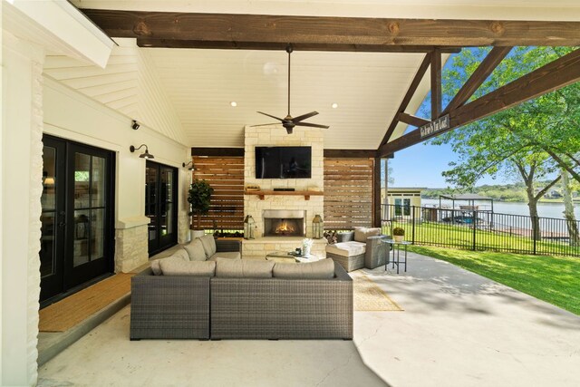 1001 Lakeshore Dr, Marble Falls, TX 78654 - view of patio / terrace with ceiling fan, an outdoor living space with a fireplace, and fence