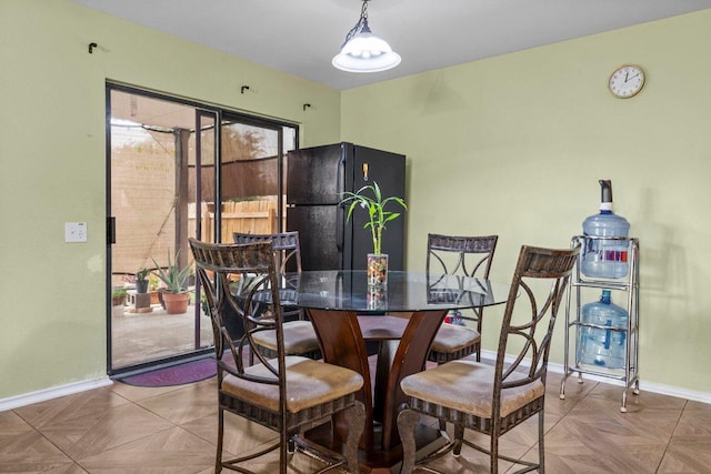 dining space featuring baseboards