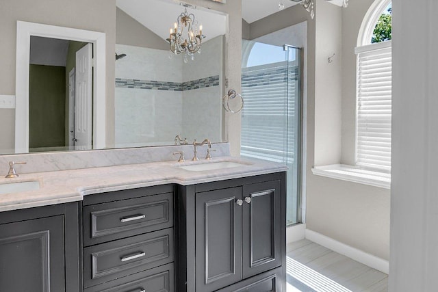 15811 De Peer Cv, Austin, TX 78717 - bathroom featuring double vanity, a shower, a chandelier, and lofted ceiling