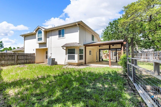 15811 De Peer Cv, Austin, TX 78717 - back of house featuring a patio area, stucco siding, and a fenced backyard