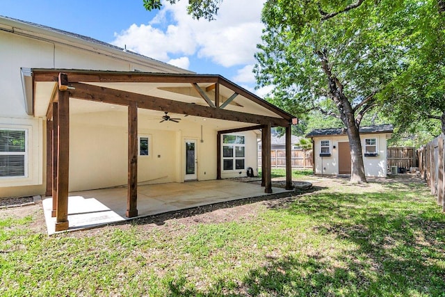 15811 De Peer Cv, Austin, TX 78717 - back of property with a ceiling fan, a fenced backyard, a patio area, and an outbuilding
