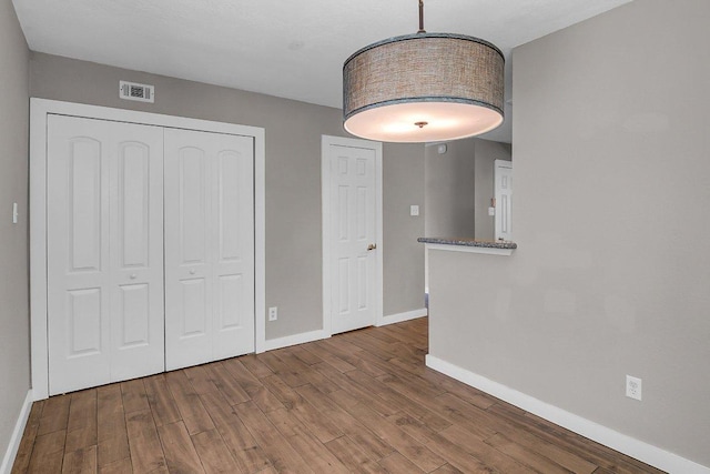 15811 De Peer Cv, Austin, TX 78717 - unfurnished dining area with baseboards and wood finished floors