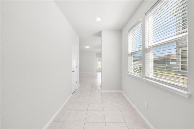 252 Fabion St, Kyle, TX 78640 - hallway with light tile patterned flooring, baseboards, and recessed lighting