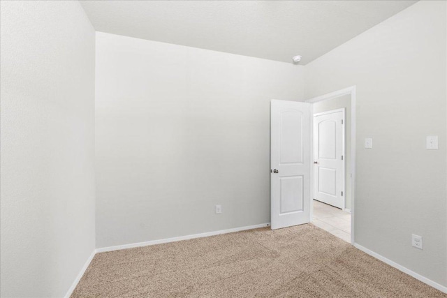 252 Fabion St, Kyle, TX 78640 - spare room featuring light carpet, baseboards, and a smoke detector