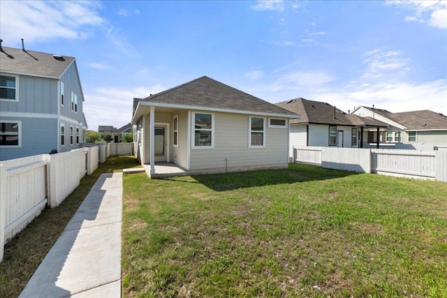 252 Fabion St, Kyle, TX 78640 - rear view of house featuring roof with shingles, a residential view, and a patio area