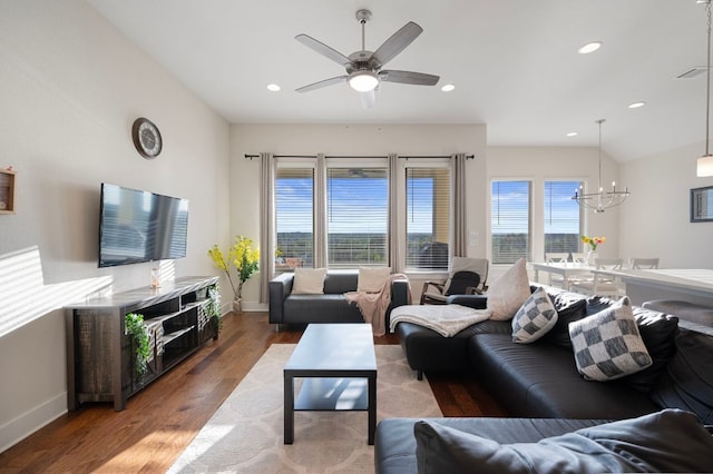 344 Pisa Ln, Georgetown, TX 78628 - living room with wood finished floors, a chandelier, baseboards, a ceiling fan, and recessed lighting