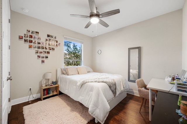344 Pisa Ln, Georgetown, TX 78628 - bedroom with dark wood-type flooring, baseboards, and a ceiling fan