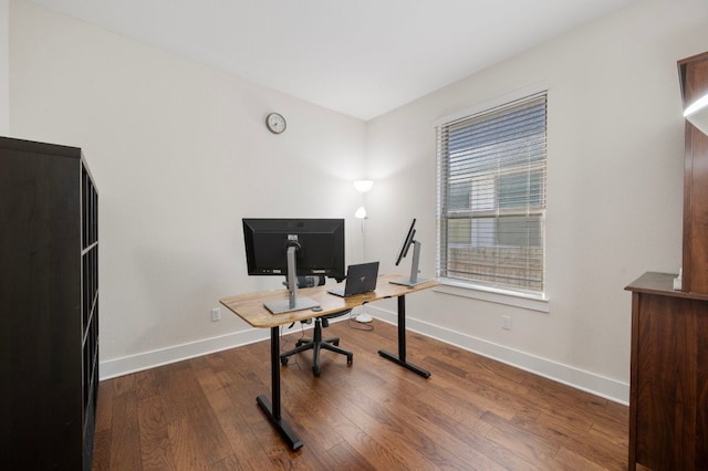 344 Pisa Ln, Georgetown, TX 78628 - home office with baseboards and dark wood-style floors