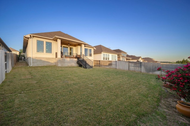 344 Pisa Ln, Georgetown, TX 78628 - rear view of property featuring stucco siding, stairs, and central AC unit