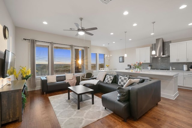 344 Pisa Ln, Georgetown, TX 78628 - living area featuring plenty of natural light, ceiling fan, recessed lighting, wood finished floors, and a chandelier
