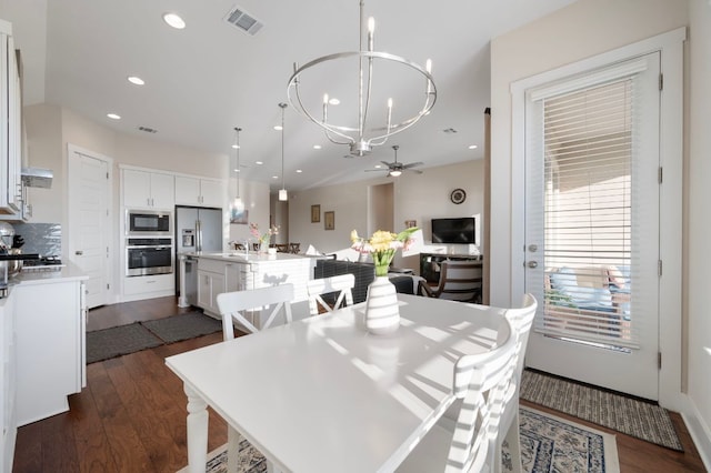 344 Pisa Ln, Georgetown, TX 78628 - dining area with a chandelier, dark wood-style floors, ceiling fan, and recessed lighting