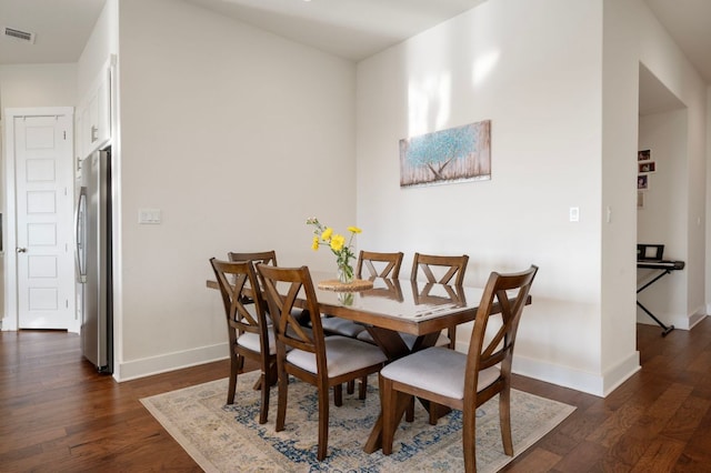 344 Pisa Ln, Georgetown, TX 78628 - dining area featuring baseboards and dark wood-style flooring