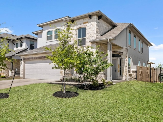 121 Audie Murphy Dr, Leander, TX 78641 - view of front facade with stone siding, an attached garage, driveway, and stucco siding
