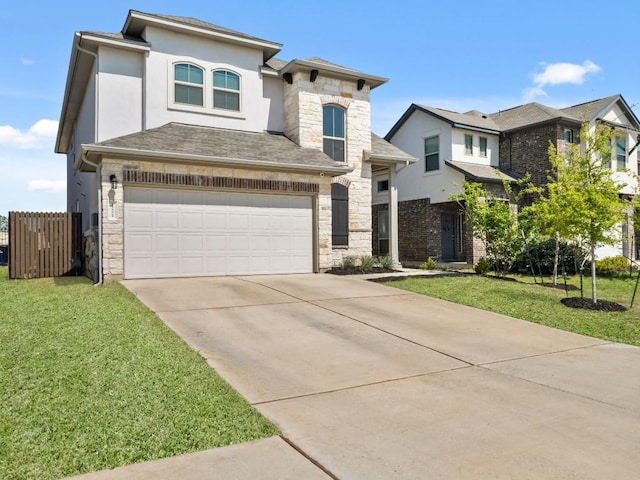 view of front facade featuring an attached garage, a front yard, driveway, and stone siding