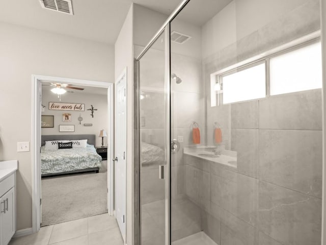 ensuite bathroom with a ceiling fan, visible vents, ensuite bathroom, and a stall shower