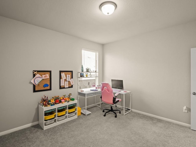 carpeted office space with baseboards