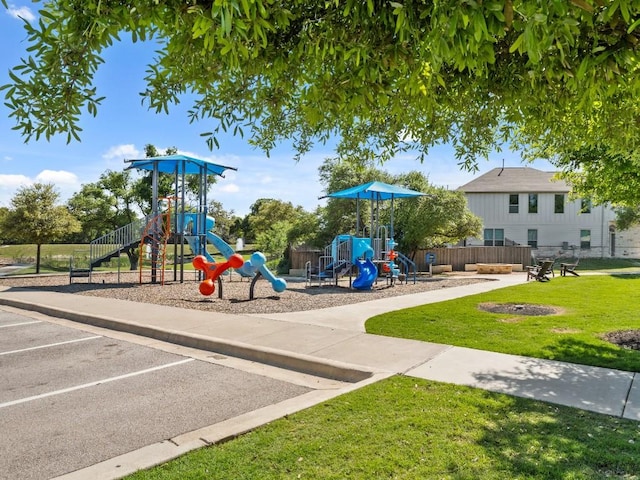 community playground with fence and a yard