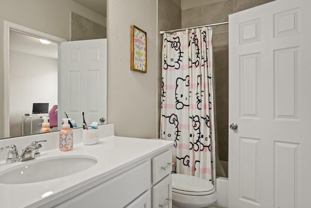 full bathroom with vanity, shower / tub combo, and toilet