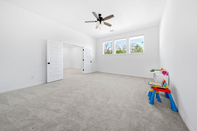 rec room featuring carpet flooring, a ceiling fan, and baseboards