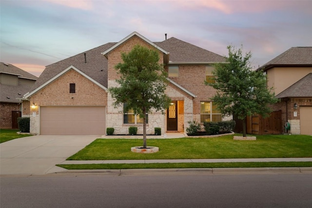 3307 Columbus Way, Round Rock, TX 78665 - view of front of home featuring driveway, stone siding, a garage, a lawn, and roof with shingles