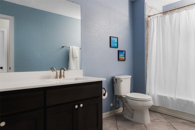 3307 Columbus Way, Round Rock, TX 78665 - bathroom with tile patterned flooring, vanity, a textured wall, and shower / bath combo with shower curtain