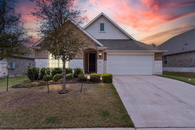 728 Clear Spring Ln, Leander, TX 78641 - traditional home featuring a garage, driveway, stone siding, and stucco siding