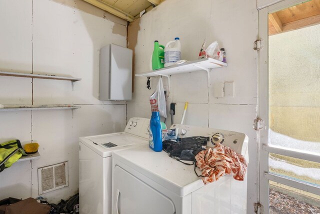 523 Ash St, Lockhart, TX 78644 - laundry room featuring visible vents, washer and clothes dryer, and laundry area