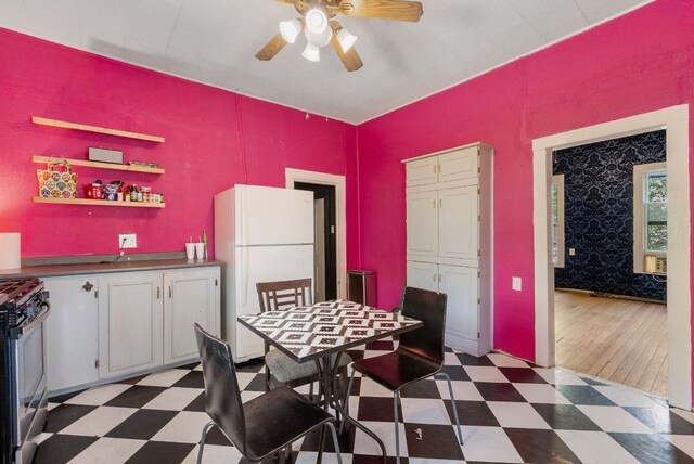 523 Ash St, Lockhart, TX 78644 - dining room with tile patterned floors and a ceiling fan