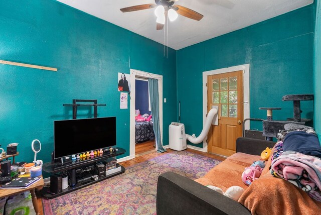 523 Ash St, Lockhart, TX 78644 - living room featuring a ceiling fan and wood finished floors
