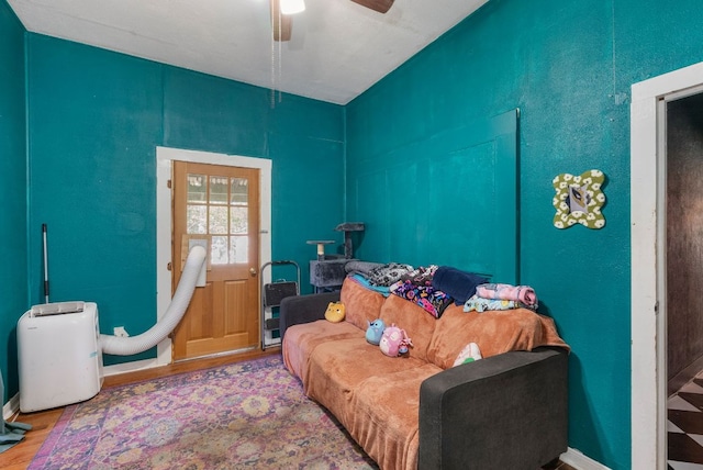 523 Ash St, Lockhart, TX 78644 - living area with ceiling fan and wood finished floors