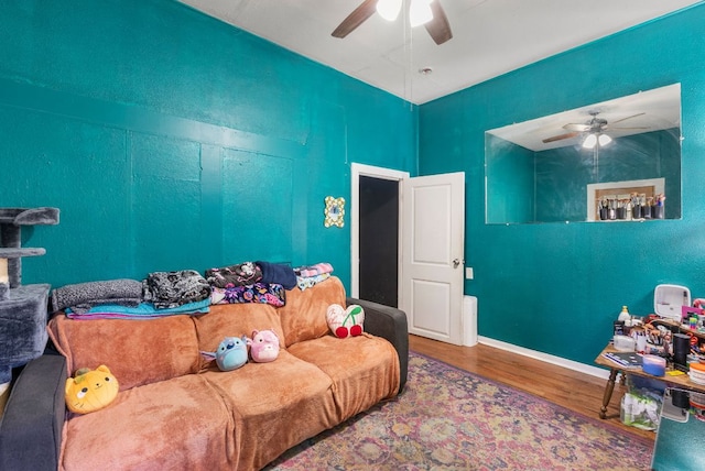 523 Ash St, Lockhart, TX 78644 - living room featuring a ceiling fan and wood finished floors