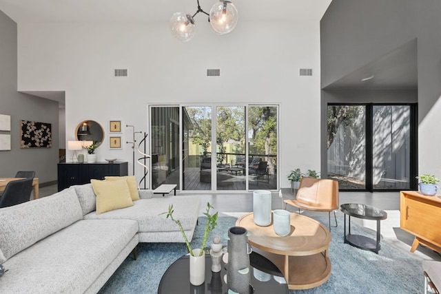 5908 Lakeside Trl, Austin, TX 78734 - living area featuring a high ceiling and a chandelier