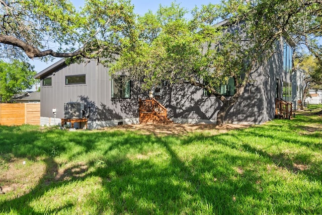 5908 Lakeside Trl, Austin, TX 78734 - rear view of house with board and batten siding and crawl space