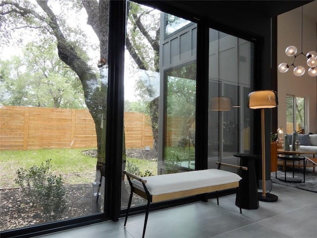 5908 Lakeside Trl, Austin, TX 78734 - doorway with healthy amount of natural light, a chandelier, and concrete flooring
