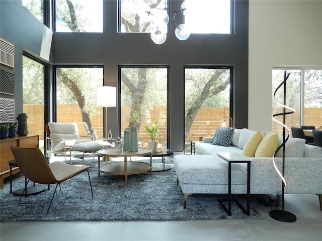 5908 Lakeside Trl, Austin, TX 78734 - living area with a high ceiling, a chandelier, and finished concrete floors