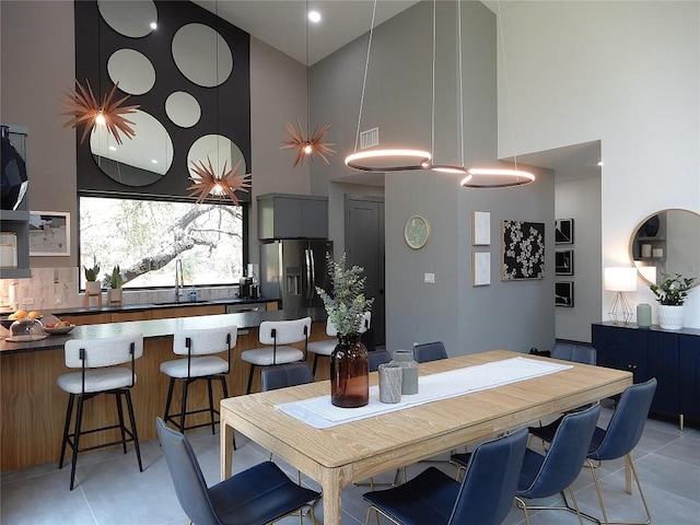 5908 Lakeside Trl, Austin, TX 78734 - dining room with high vaulted ceiling and light tile patterned floors