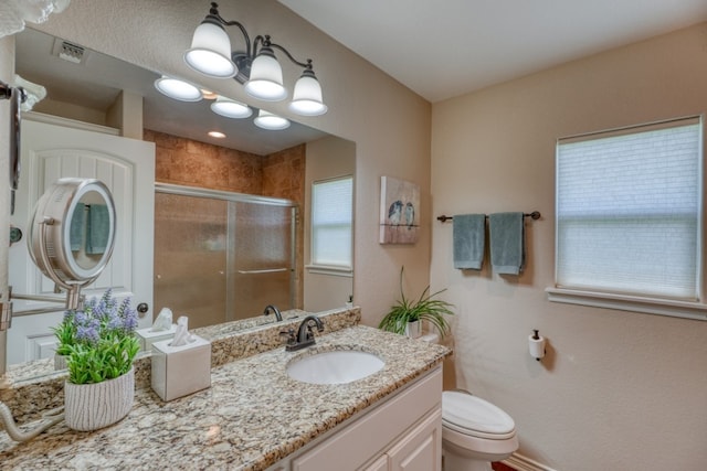 103 Ladera Cv, Marble Falls, TX 78654 - bathroom with vanity, an enclosed shower, and toilet