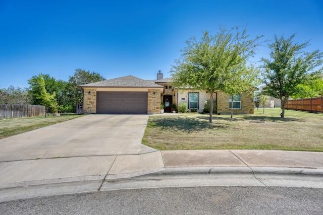 103 Ladera Cv, Marble Falls, TX 78654 - view of front facade with an attached garage, concrete driveway, stone siding, and a chimney
