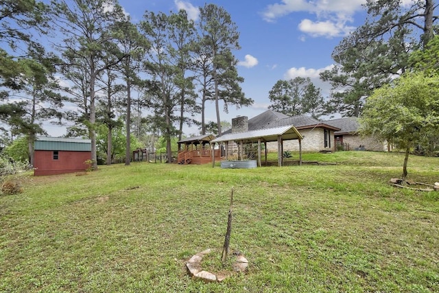 view of yard with an outbuilding and a storage unit
