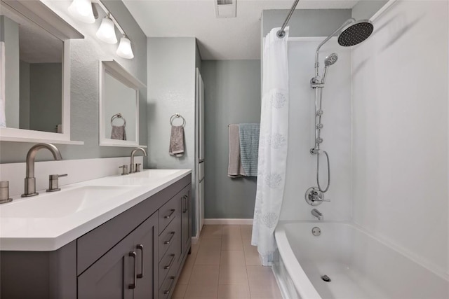 14585 Robert I Walker Blvd, Austin, TX 78728 - full bathroom with tile patterned flooring, shower / bathtub combination with curtain, double vanity, and baseboards