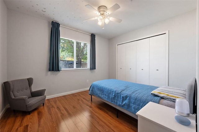 14585 Robert I Walker Blvd, Austin, TX 78728 - bedroom with baseboards, wood finished floors, a closet, and ceiling fan