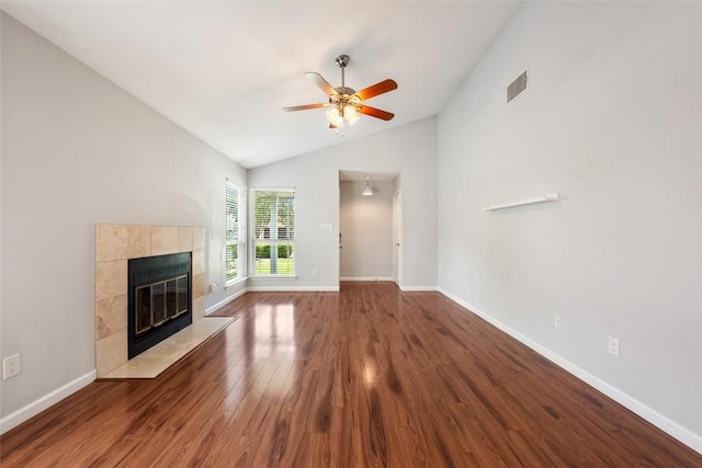 14585 Robert I Walker Blvd, Austin, TX 78728 - unfurnished living room featuring lofted ceiling, dark wood-style flooring, ceiling fan, and a tile fireplace
