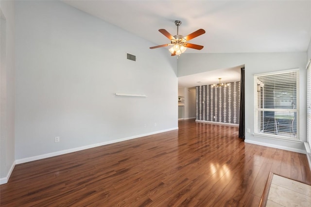 14585 Robert I Walker Blvd, Austin, TX 78728 - unfurnished living room featuring vaulted ceiling, a chandelier, wood finished floors, and a ceiling fan