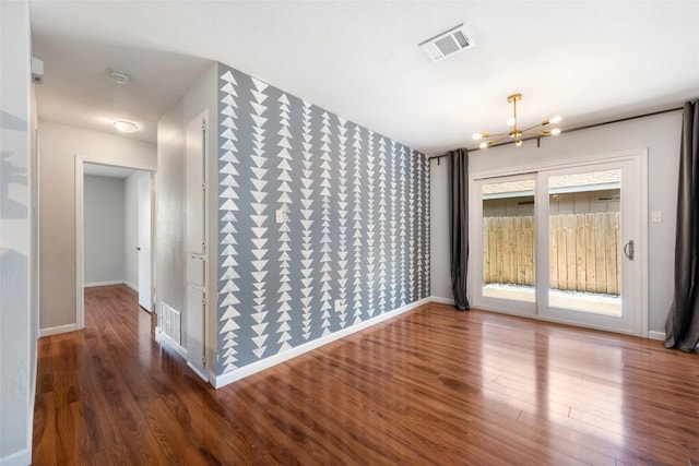 14585 Robert I Walker Blvd, Austin, TX 78728 - empty room with a chandelier, wood finished floors, and a smoke detector