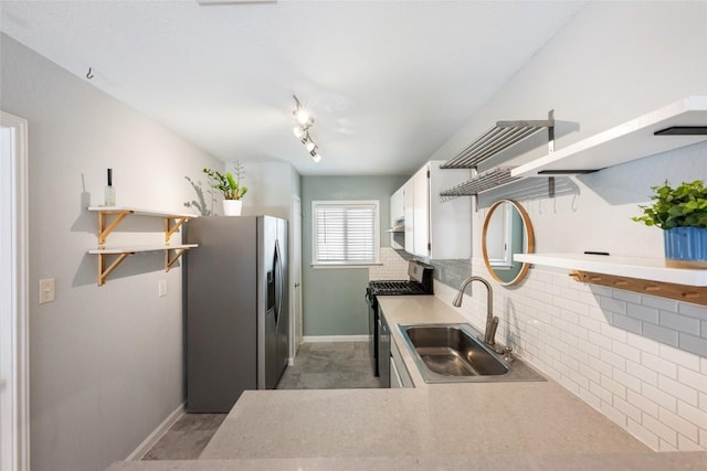 14585 Robert I Walker Blvd, Austin, TX 78728 - kitchen featuring appliances with stainless steel finishes, open shelves, white cabinetry, backsplash, and light countertops