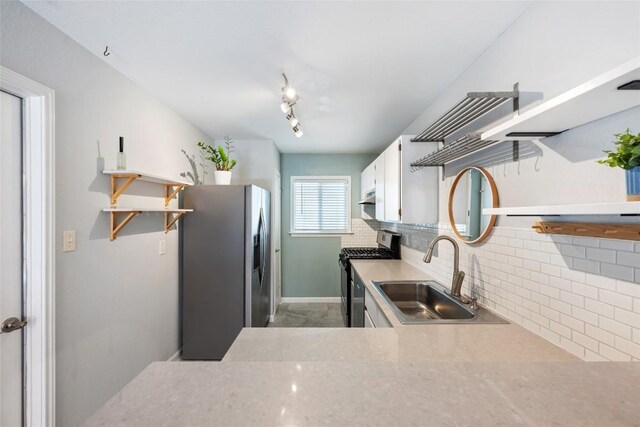 14585 Robert I Walker Blvd, Austin, TX 78728 - kitchen featuring open shelves, range with gas stovetop, stainless steel refrigerator with ice dispenser, backsplash, and white cabinets