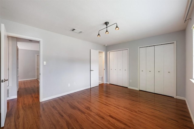 14585 Robert I Walker Blvd, Austin, TX 78728 - unfurnished bedroom with two closets and wood finished floors