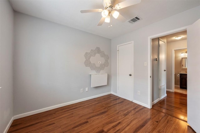14585 Robert I Walker Blvd, Austin, TX 78728 - unfurnished bedroom featuring wood finished floors and a ceiling fan